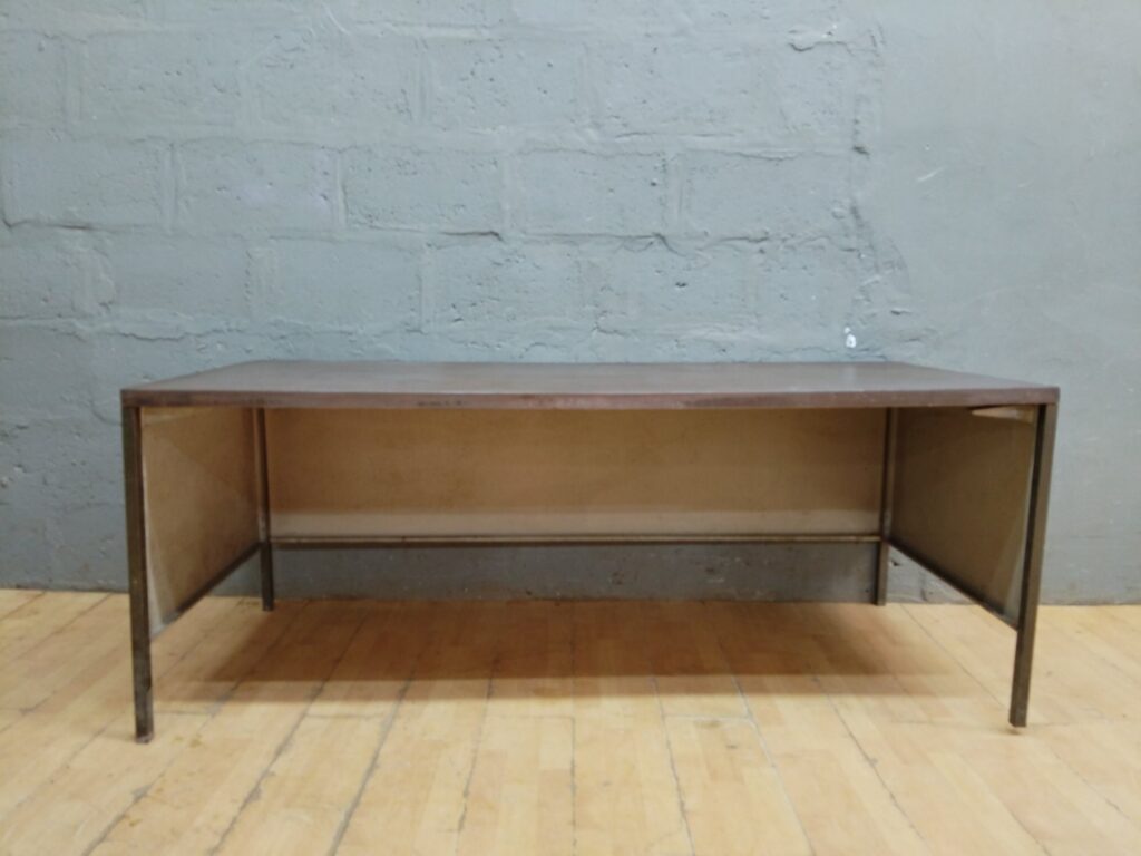 Metal‑framed desk with veneered top — 183 x 76 x 74 cm — worn surface, veneer lifting, scuffed legs