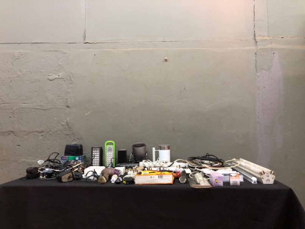 Mixed lot of 49 small electrical items — adaptors, powerboards, cables, bulbs, tubes, torches & multimeter