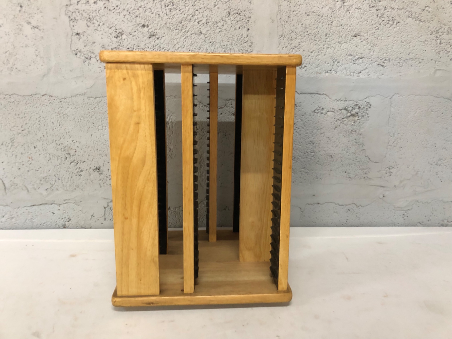 Wooden rotating CD/DVD carousel storage rack — rotates freely, black divider rails