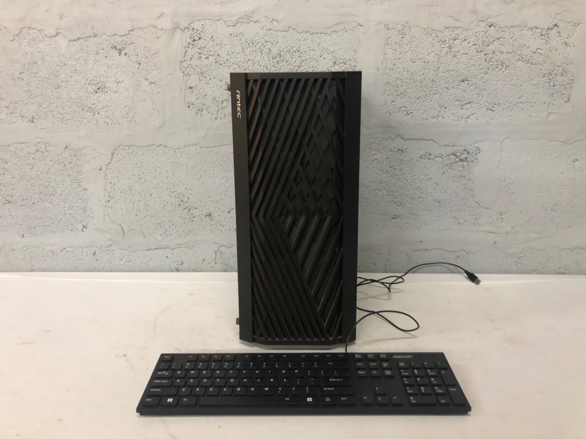 Antec mid-tower PC case (tempered glass side) + Mecer MK-U03BK wired USB keyboard — case only, no internal components